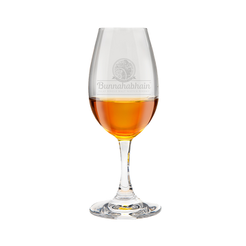 Glencairn whisky copita glass with the Bunnahabhain logo containing whisky inside